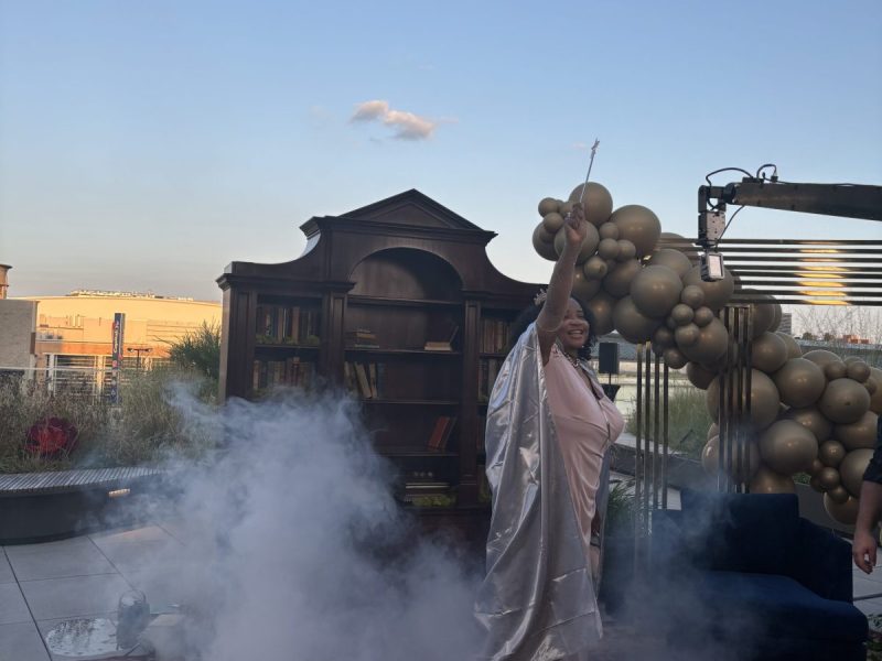 Guests of the inaugural Dream Gala were surrounded by smoke, gold balloons and hopes and dreams as they worked the magic red carpet on the rooftop of MLK Library. (Jada Ingleton/The Washington Informer)